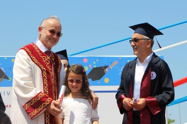 Former rector graduates from same university