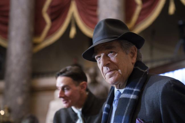 FILE - Paul Pelosi attends a portrait unveiling ceremony for his wife, Speaker of the House Nancy Pelosi, D-Calif., in Statuary Hall at the Capitol in Washington, Dec. 14, 2022. The man charged in last year's attack against former U.S. House Speaker Nancy Pelosi's husband is scheduled to appear in federal court Wednesday, July 19, 2023, to request the trial be moved out of San Francisco. (AP Photo/J. Scott Applewhite, File)