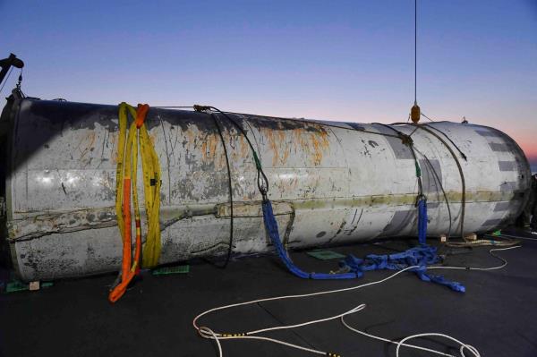 Part of what is believed to be a 'space launch vehicle' that North Korea said crashed into the sea off the west coast of the divided peninsula was salvaged by the South Korean military. | SOUTH KOREAN DEFENSE MINISTRY/HANDOUT VIA REUTERS