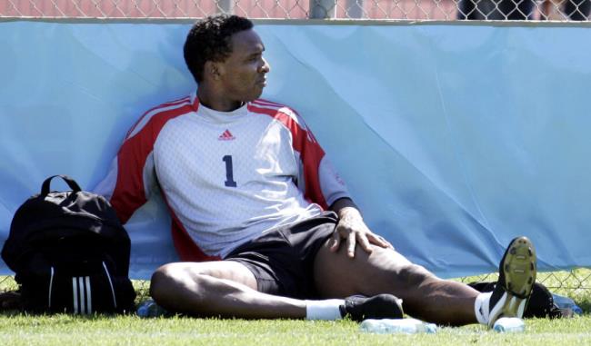 Trinidad and Tobago's goalie Shaka Hislop rests in the shade during World Cup soccer training,  Sunday, June 11, 2006, in Rotenburg, nothern Germany. Trinidad and Tobago play in Group B, with England, Sweden and Paraguay.  (AP Photo/Kai-Uwe Knoth)