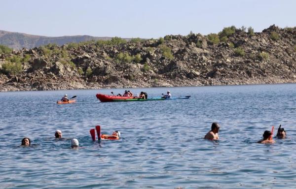 Swimmers flock to Nemrut Crater Lake amid festival