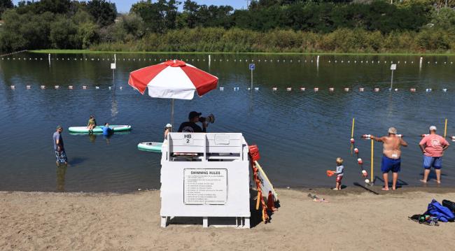 Supervising lifeguard Jim Boyce welcomes swimmers  to Healdsburg Veterans Memorial Beach, Friday, July 21, 2023. (Kent Porter / The Press Democrat)
