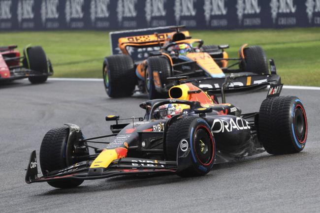 Red Bull driver Max Verstappen of the Netherlands, right, and McLaren driver Oscar Piastri of Australia steer their cars during the sprint race ahead of the Formula One Grand Prix at the Spa-Francorchamps racetrack in Spa, Belgium, Saturday, July 29, 2023. The Belgian Formula One Grand Prix will take place on Sunday. (AP Photo/Geert Vanden Wijngaert)