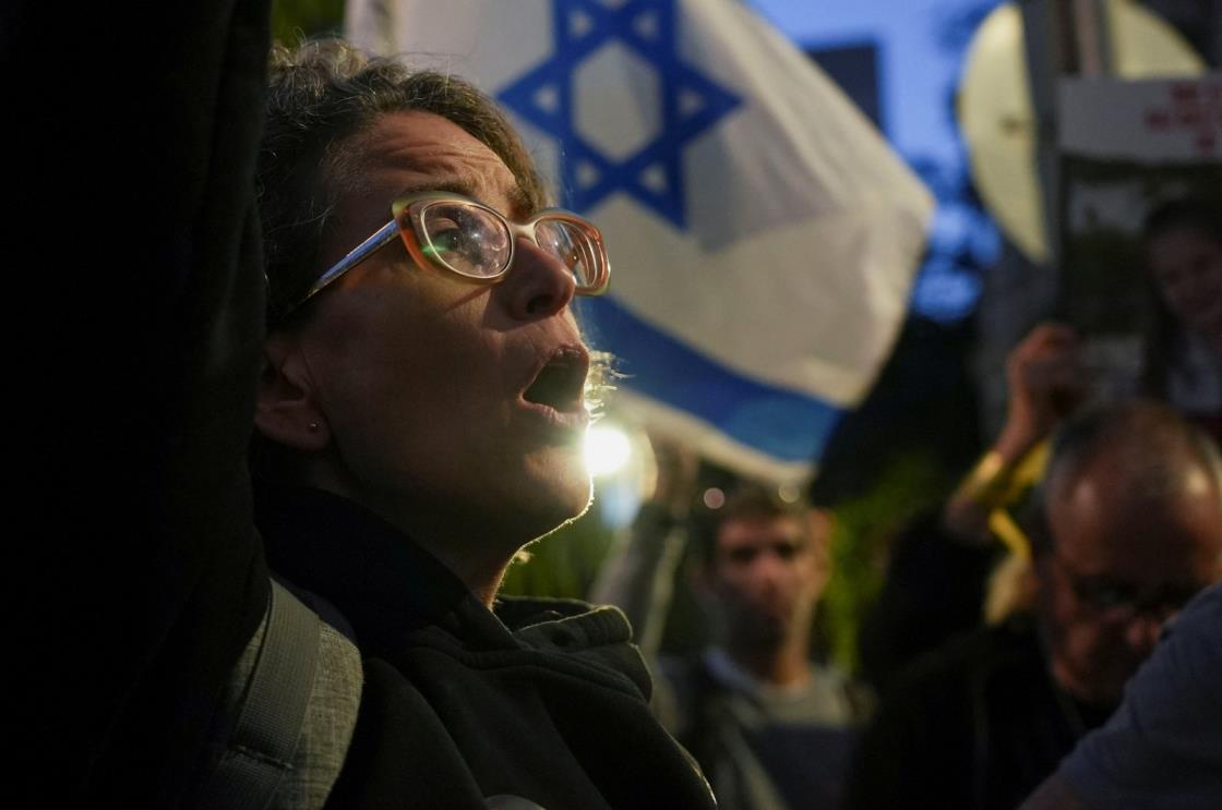 Protesters hold placards in Tel Aviv, Israel, Nov. 20, 2023. (Reuters Photo)
