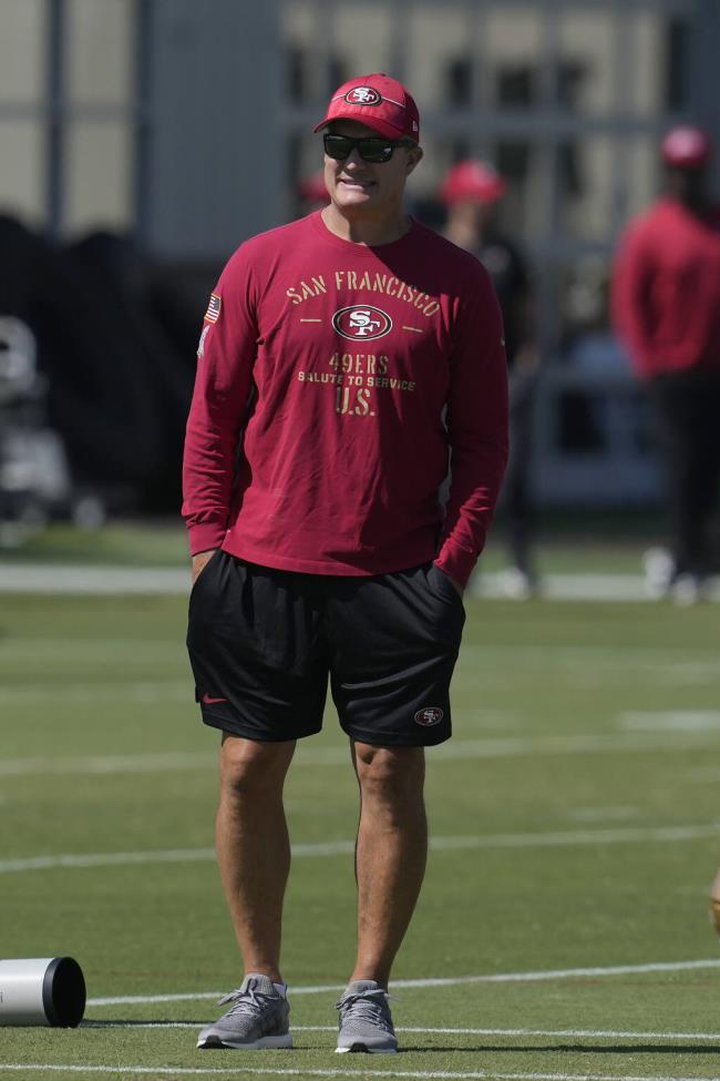 San Francisco 49ers general manager John Lynch watches as players take part in drills during the NFL team's football training camp in Santa Clara, Calif., Monday, July 31, 2023. (AP Photo/Jeff Chiu)