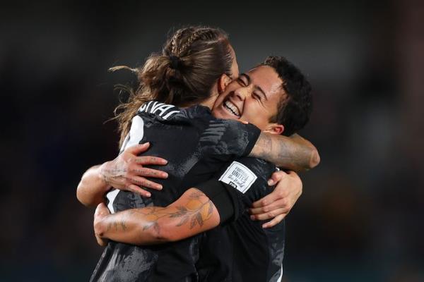 Ria Percival (L) and Malia Steinmetz (R) of New Zealand embrace after the team's historic 1-0 victory.