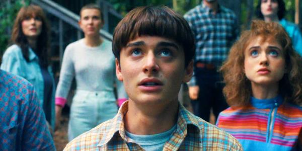 Noah Schnapp as Will looking up the sky, worried, in the Stranger Things season 4 finale.