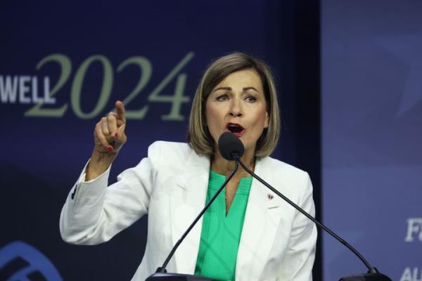 Iowa Governor Kim Reynolds speaks to guests before signing into law a bill that will ban most abortions after around six weeks of pregnancy during a visit to the Family Leadership Summit on July 14, 2023 in Des Moines, Iowa.