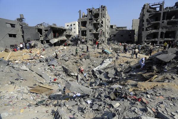 Palestinians wander among debris of buildings that were targeted by Israeli airstrikes in Jabaliya refugee camp, northern Gaza Strip, Wednesday, Nov. 1, 2023. Picture: AP Photo/Abed Khaled