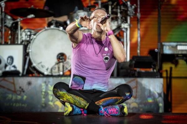 Chris Martin of Coldplay performs at the Rose Bowl, Saturday, Sept. 30, 2023, in Pasadena, Calif. (AP Photo/Chris Pizzello)