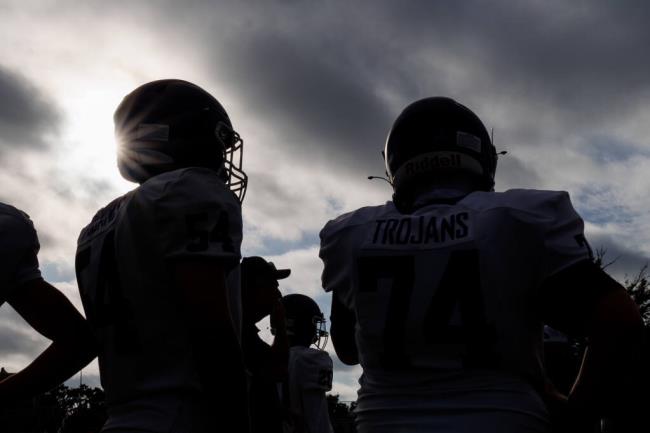Petaluma’s football players cheer on their football team at Santa Rosa High School on September 1, 2023. (Abraham Fuentes /For The Press Democrat)