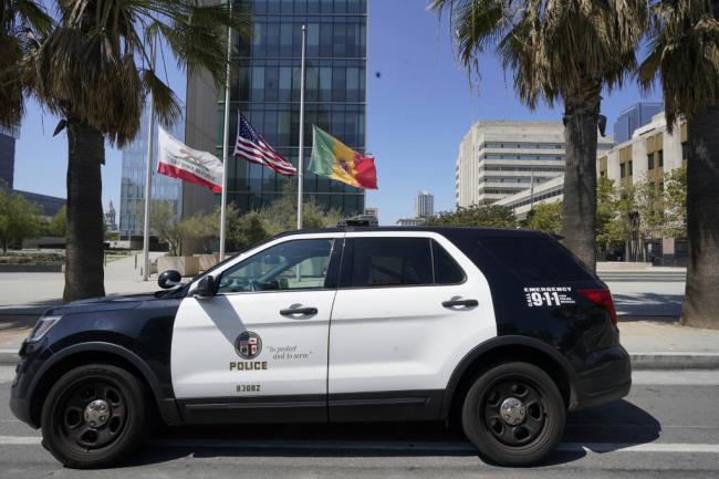 FILE - A Los Angeles Police Department vehicle is parked outside the LAPD headquarters in downtown Los Angeles on July 8, 2022. (AP Photo/Damian Dovarganes, File)