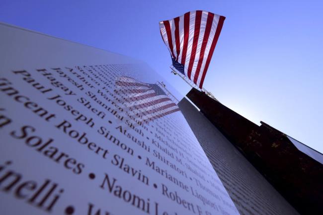 An American flag flies over during a ceremony at the 9/11 Memorial Garden in Napa on Monday, Sept. 11, 2023. (Beth Schlanker / The Press Democrat)