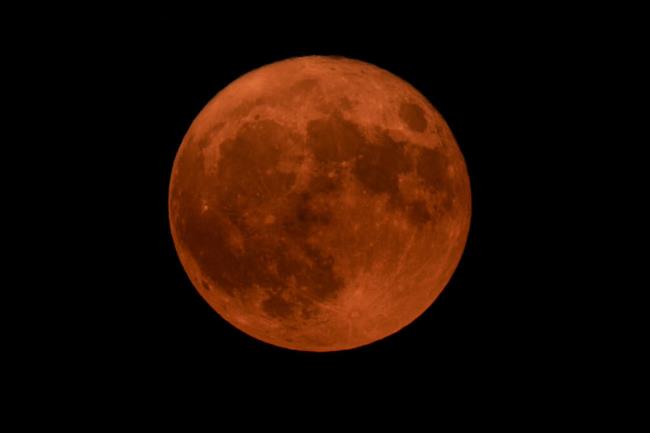 The supermoon rises above Washington, Tuesday, Aug. 1, 2023. (AP Photo/Carolyn Kaster)