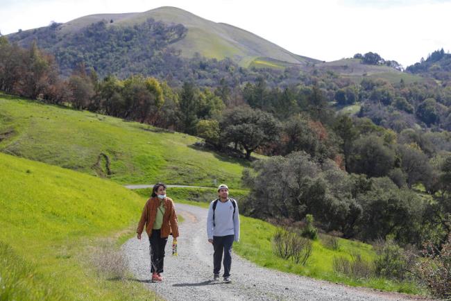 Sofia Lopez and German Jimenez hike along the Pony Gate Trail in Sugarloaf Ridge State Park near Kenwood, Monday, March 22, 2021. (Christopher Chung / The Press Democrat file)