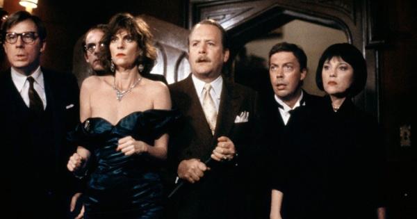 The cast of Clue stands close together.