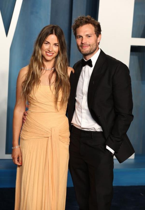 Jamie on the red carpet with his wife, actress Amelia Warner, who he married in 2013