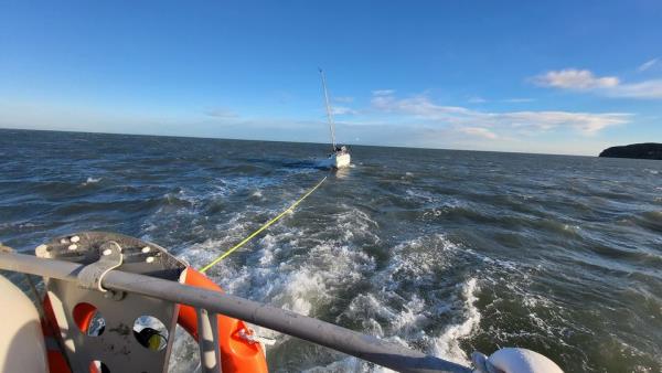 The Howth RNLI team towing the yacht to safety. Photo: RNLI.