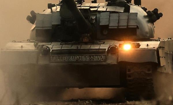 This photo carried by the North's official Korean Central News Agency shows a North Korean tank with a banner in Korean that reads, 