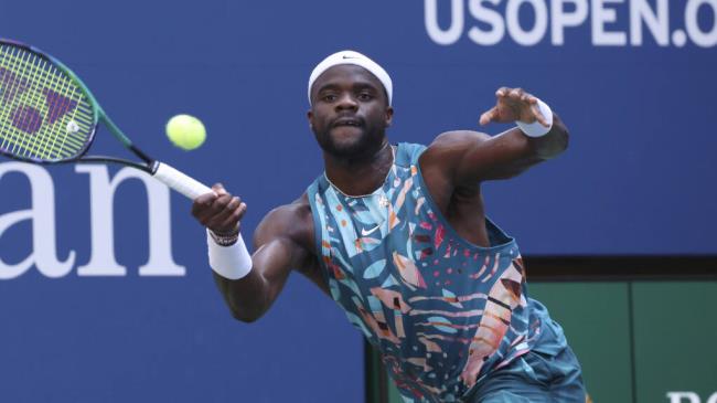 Frances Tiafoe, of the United States, returns to Rinky Hijikata, of Australia, during the fourth round of the U.S. Open tennis championships, Sunday, Sept. 3, 2023, in New York. (AP Photo/Jason DeCrow)
