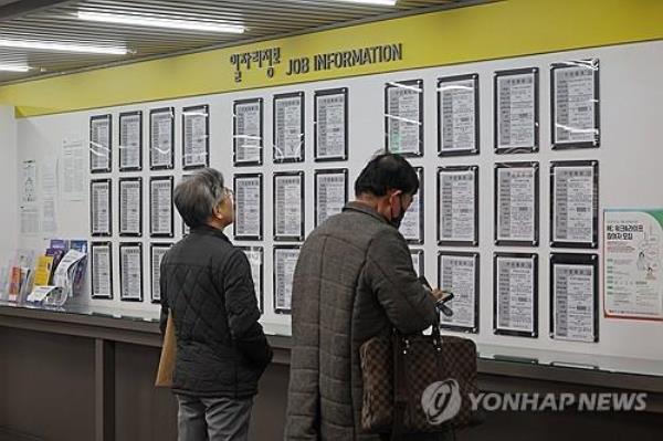 Jobseekers check job postings at an employment center in Seoul, in this file photo taken March 13, 2024. (Yonhap)