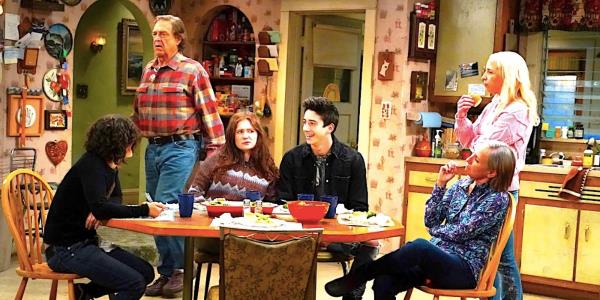 Darlene, Dan, Harris, Becky, Jackie and a guest sit around the kitchen table in The Conners-1